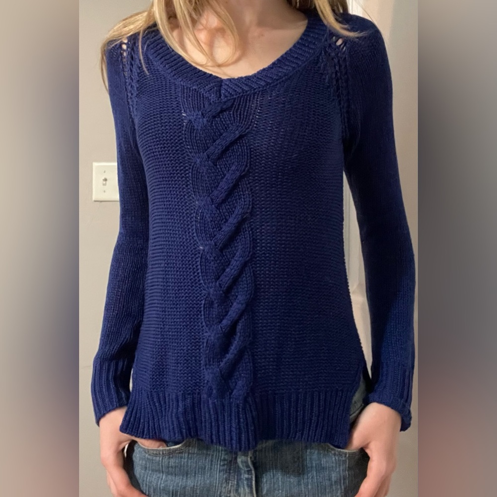 Royal blue sweater with pretty details all over.